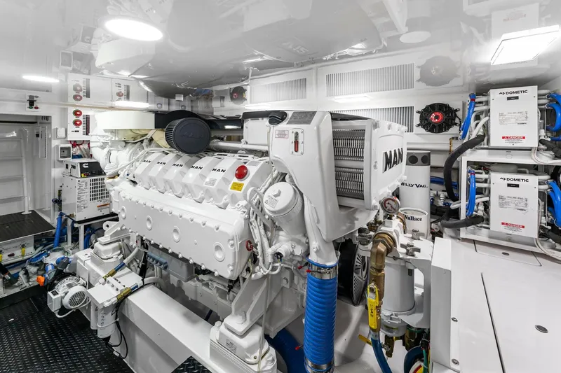 Slide: The Image of Engine room of 2025 Viking 58 Convertible yacht, featuring advanced MAN engine systems. - 71