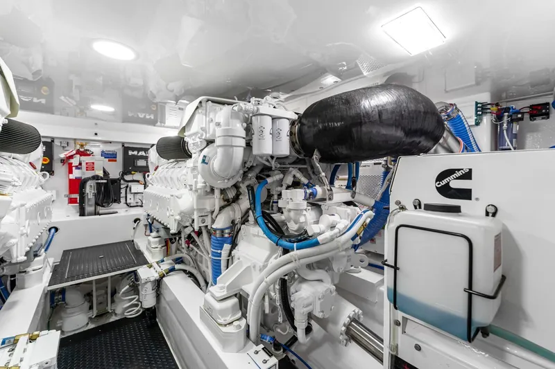 Slide: The Image of Engine room of 2025 Viking 58 Convertible yacht, featuring advanced machinery and Cummins components. - 74