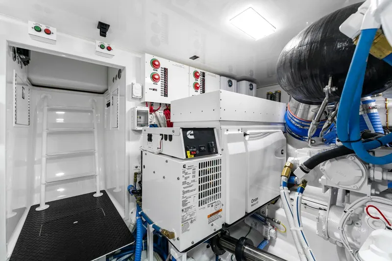 Slide: The Image of Engine room of 2025 Viking 58 Convertible yacht, featuring advanced machinery and equipment. - 76