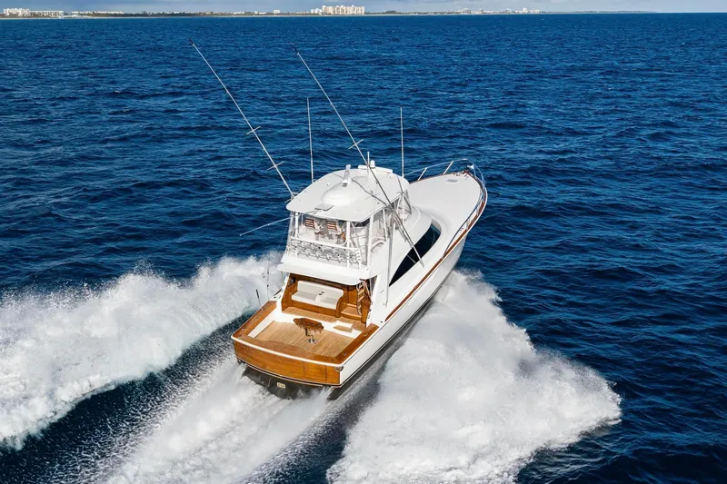 Slide: The Image of 2025 Viking 58 Convertible yacht cruising on open ocean waters. - 8