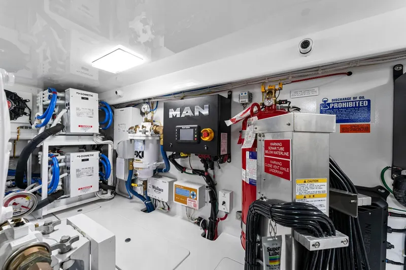 Slide: The Image of Engine room of 2025 Viking 58 Convertible yacht with advanced equipment and safety features. - 80