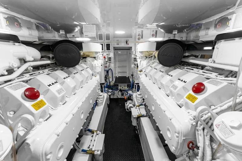 Slide: The Image of Engine room of 2025 Viking 58 Convertible yacht, featuring dual MAN engines. - 82
