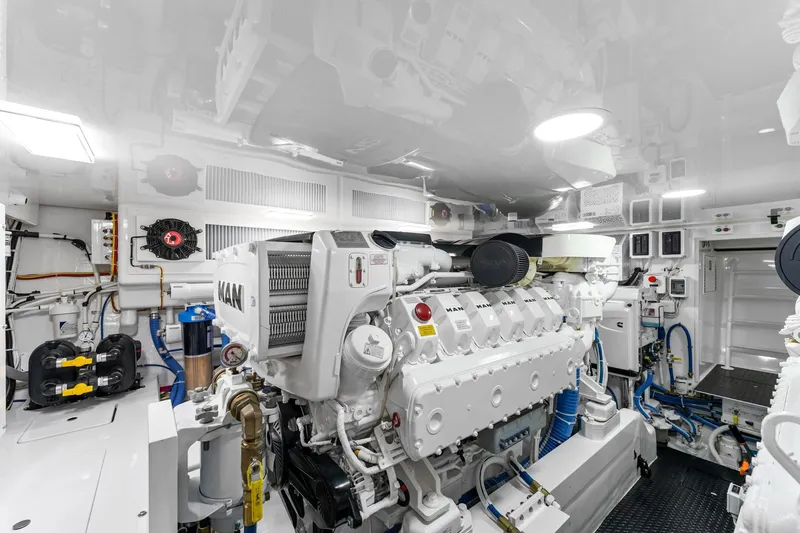 Slide: The Image of Engine room of 2025 Viking 58 Convertible yacht, featuring advanced MAN engines. - 84