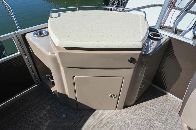 Slide: The Image of 2021 Bennington SX 23 Entertainment boat interior with countertop and storage. - 10