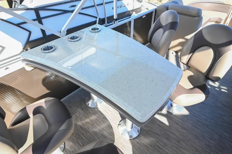 Slide: The Image of 2021 Bennington SX 23 Entertainment boat interior with table and seating arrangement. - 13