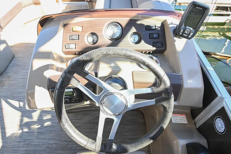 Slide: The Image of Steering console of 2021 Bennington SX 23 Entertainment boat with Garmin device. - 18