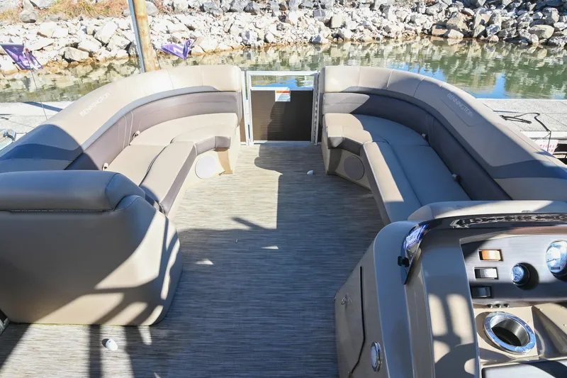 Slide: The Image of 2021 Bennington SX 23 Entertainment boat interior with plush seating and modern controls. - 20