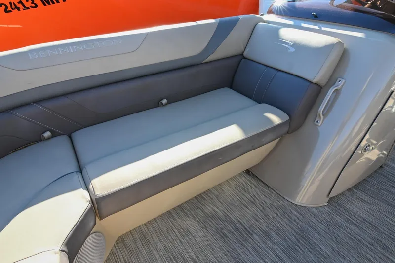 Slide: The Image of 2021 Bennington SX 23 Entertainment boat interior with gray seating and sleek design. - 25