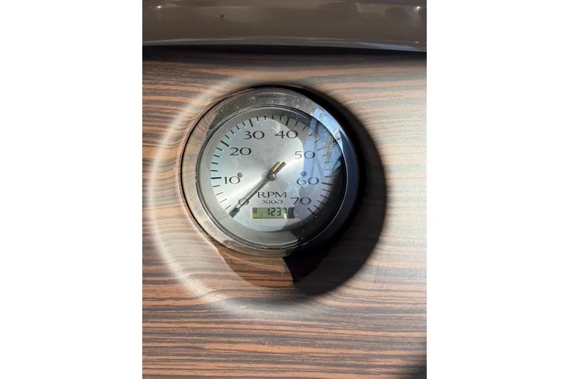 Slide: The Image of Tachometer on 2021 Bennington SX 23 Entertainment boat dashboard, showing RPM and digital display. - 27