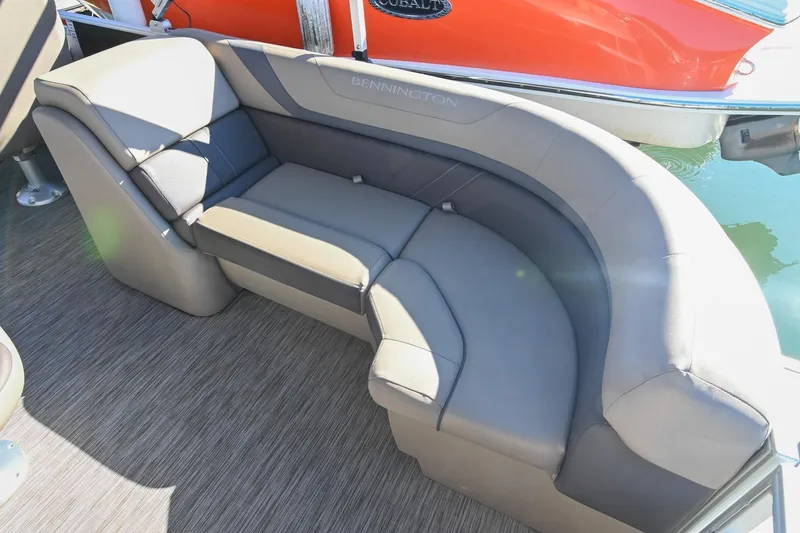 Slide: The Image of 2021 Bennington SX 23 Entertainment boat with luxurious gray seating and sleek design. - 7