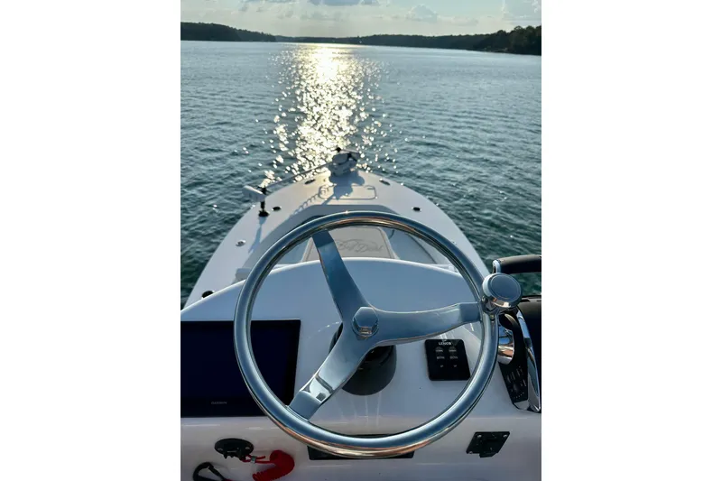 Slide: The Image of 2024 ZCB Freemason 26 Open boat with dual Mercury engines on a trailer. - 11