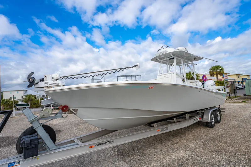 Slide: The Image of 2024 ZCB Freemason 26 Open boat on trailer under blue sky. - 16