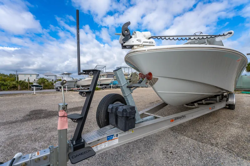 Slide: The Image of 2024 ZCB Freemason 26 Open boat on trailer, parked outdoors under cloudy sky. - 17
