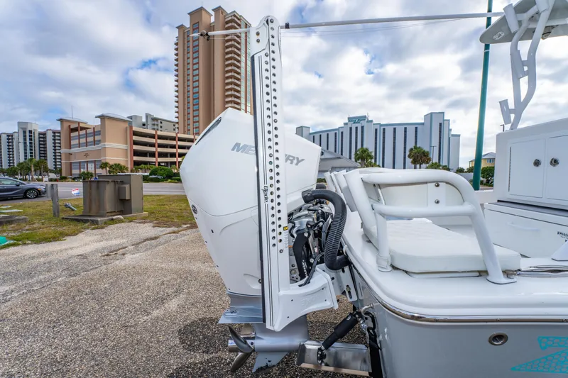 Slide: The Image of 2024 ZCB Freemason 26 Open boat with Mercury engine, urban backdrop. - 19