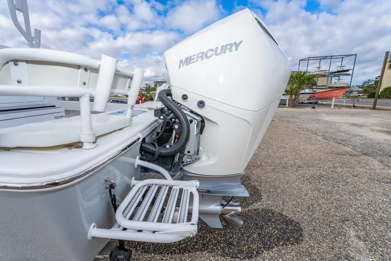 Slide: The Image of 2024 ZCB Freemason 26 Open boat with Mercury outboard motor, docked outdoors. - 20