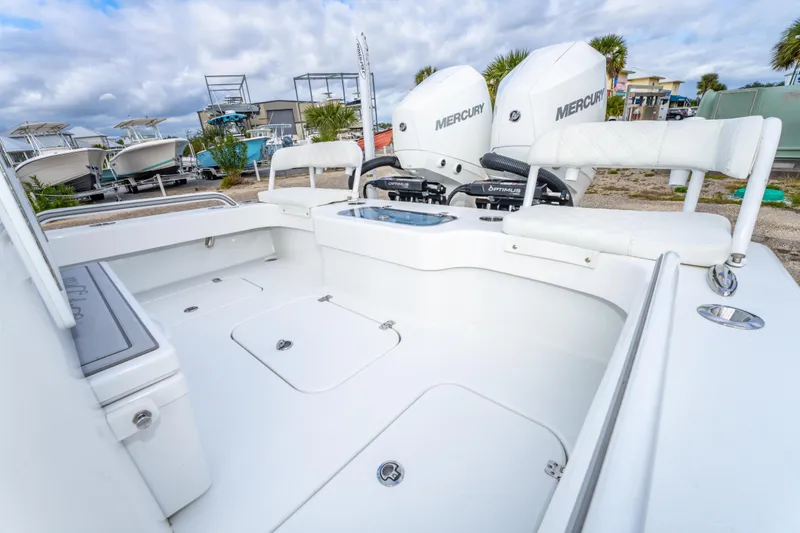 Slide: The Image of 2024 ZCB Freemason 26 Open boat with dual Mercury engines, spacious deck, and seating. - 23