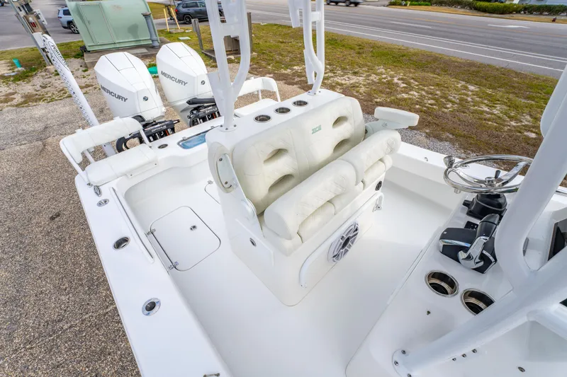 Slide: The Image of 2024 ZCB Freemason 26 Open boat interior with dual Mercury engines and white seating. - 27
