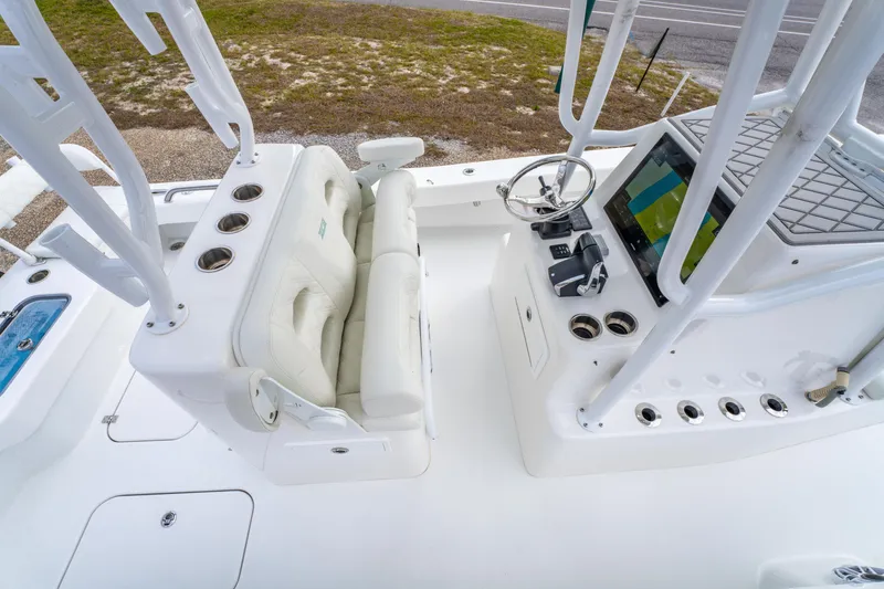 Slide: The Image of 2024 ZCB Freemason 26 Open boat interior with steering console and seating. - 28