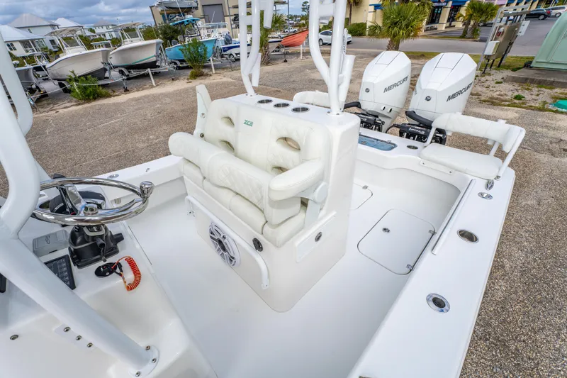 Slide: The Image of 2024 ZCB Freemason 26 Open boat interior with dual Mercury engines, white seating, and steering console. - 29