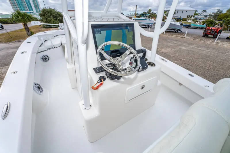 Slide: The Image of 2024 ZCB Freemason 26 Open boat interior with steering console and navigation display. - 31