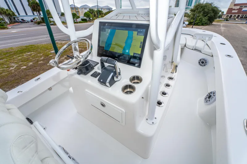 Slide: The Image of 2024 ZCB Freemason 26 Open boat console with navigation display and steering wheel. - 32