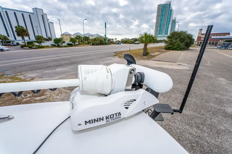 Slide: The Image of Minn Kota Ulterra motor on ZCB Freemason 26 Open, 2024 model, near coastal road. - 39