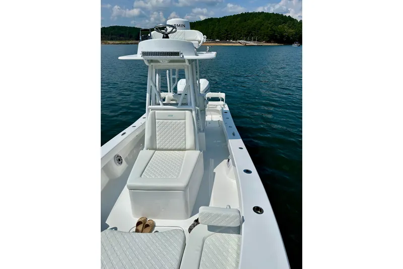 Slide: The Image of 2024 ZCB Freemason 26 Open boat on water, clear sky background. - 4