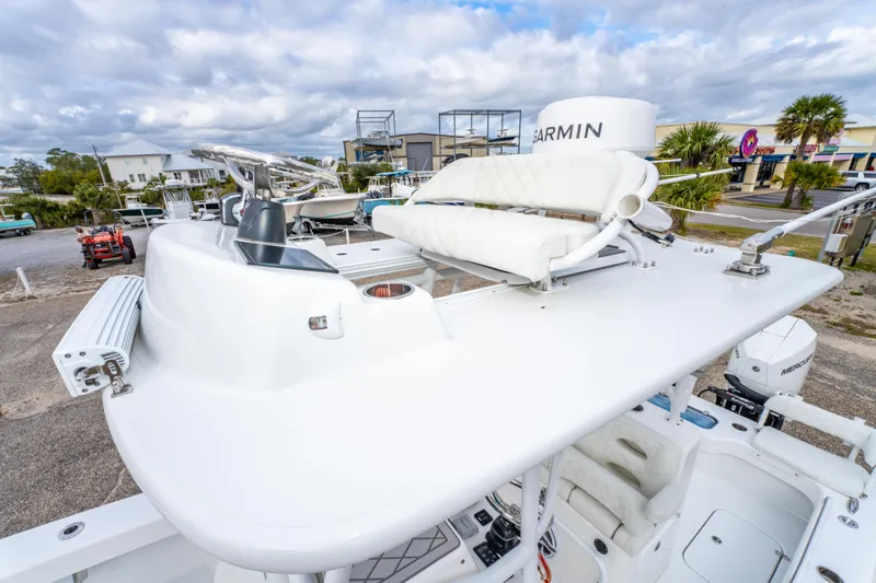 Slide: The Image of 2024 ZCB Freemason 26 Open boat with radar and seating on deck, parked outdoors. - 44