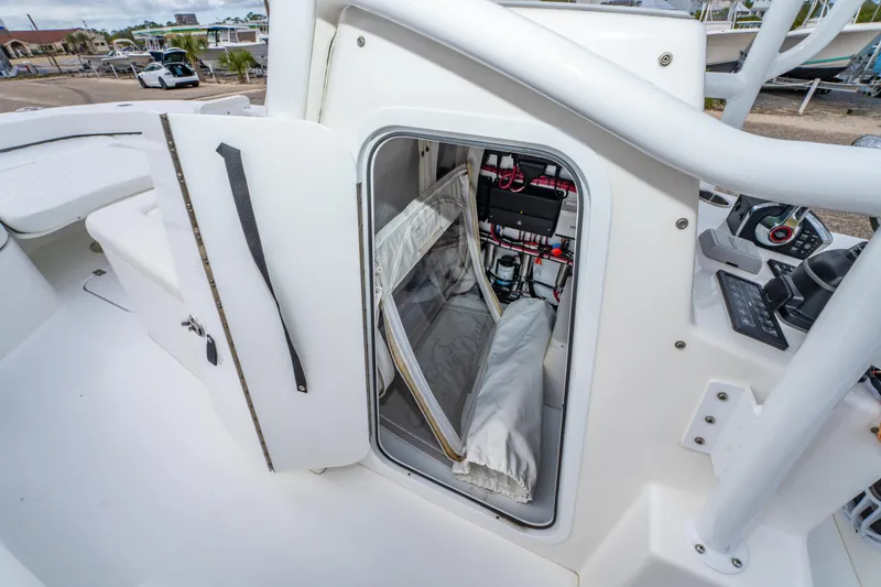 Slide: The Image of 2024 ZCB Freemason 26 Open boat interior with storage compartment and control panel. - 47