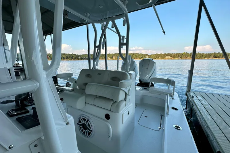 Slide: The Image of 2024 ZCB Freemason 26 Open boat on water, featuring Mercury engine. - 5