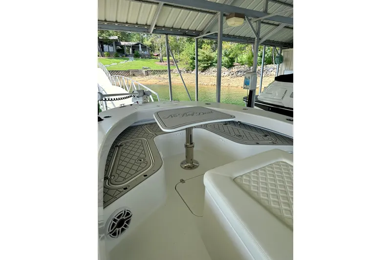Slide: The Image of 2024 ZCB Freemason 26 Open boat with Garmin equipment, docked in a marina. - 9