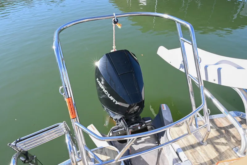 Slide: The Image of 2023 Crest Caribbean LX 250 boat with Mercury outboard motor on calm water. - 10