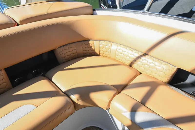 Slide: The Image of 2023 Crest Caribbean LX 250 boat with luxurious tan seating and stylish design. - 16