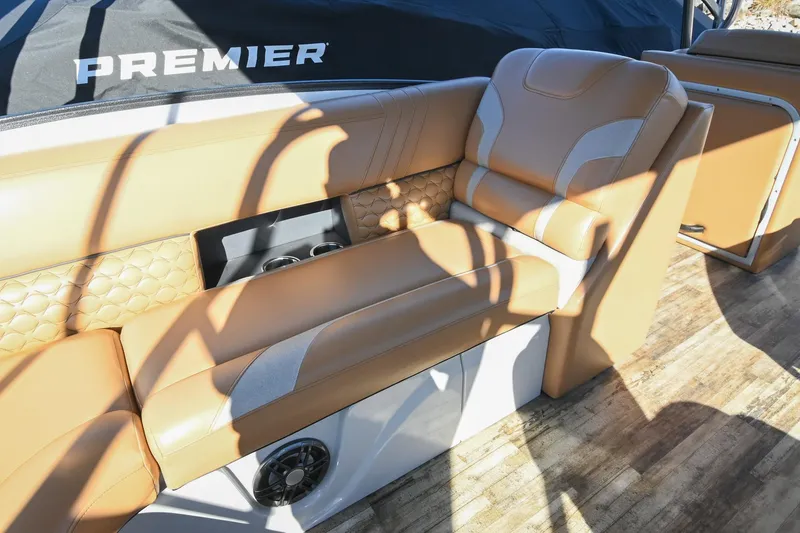 Slide: The Image of Luxurious seating on 2023 Crest Caribbean LX 250 boat with tan upholstery and cup holders. - 17