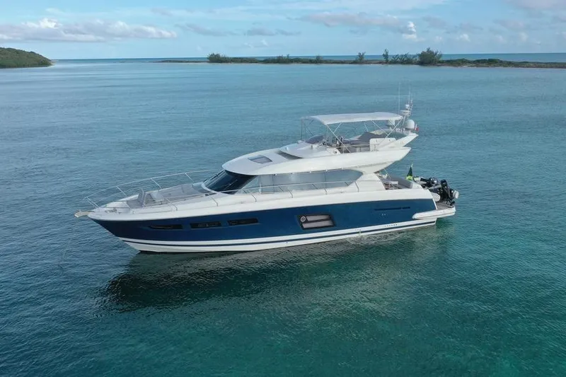 The Image of Luxury 2013 Prestige 620 yacht cruising in clear blue waters. - 1