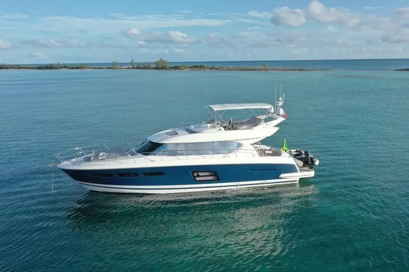 Slide: The Image of Luxurious 2013 Prestige 620 yacht cruising in clear blue waters. - 2