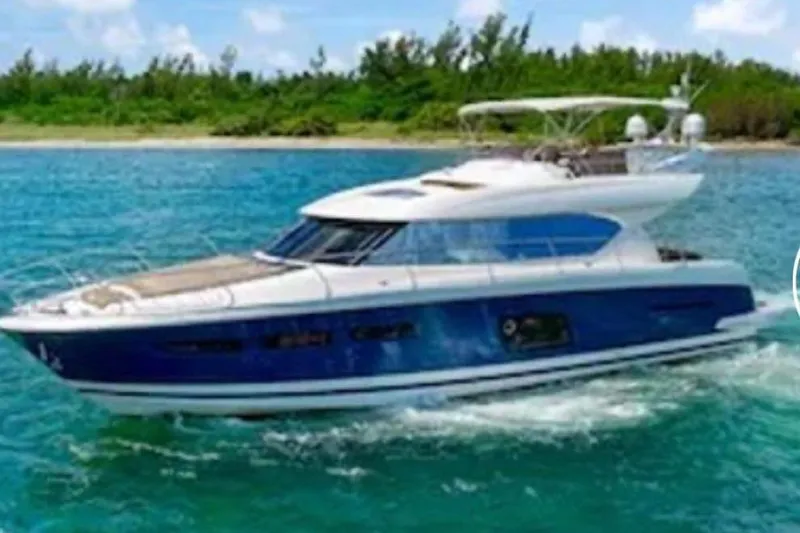 Slide: The Image of Luxury 2013 Prestige 620 yacht cruising in clear blue waters. - 3
