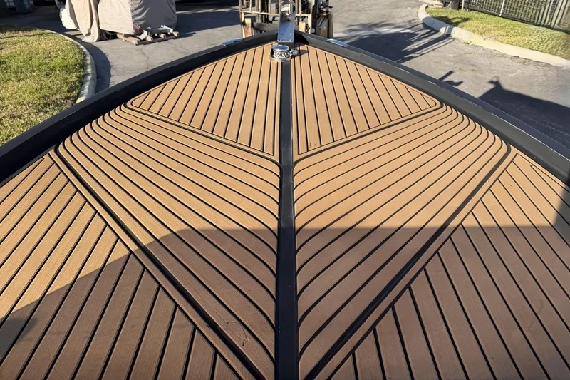 Slide: The Image of 2023 D-Boat Diamond 550 deck with sleek wood finish and modern design. - 10