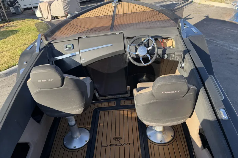 Slide: The Image of 2023 D-Boat Diamond 550 interior with dual seats and modern steering wheel design. - 2
