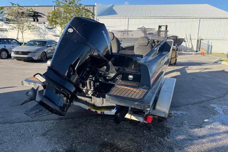 Slide: The Image of 2023 D-Boat Diamond 550 on trailer, featuring a powerful outboard motor. - 4