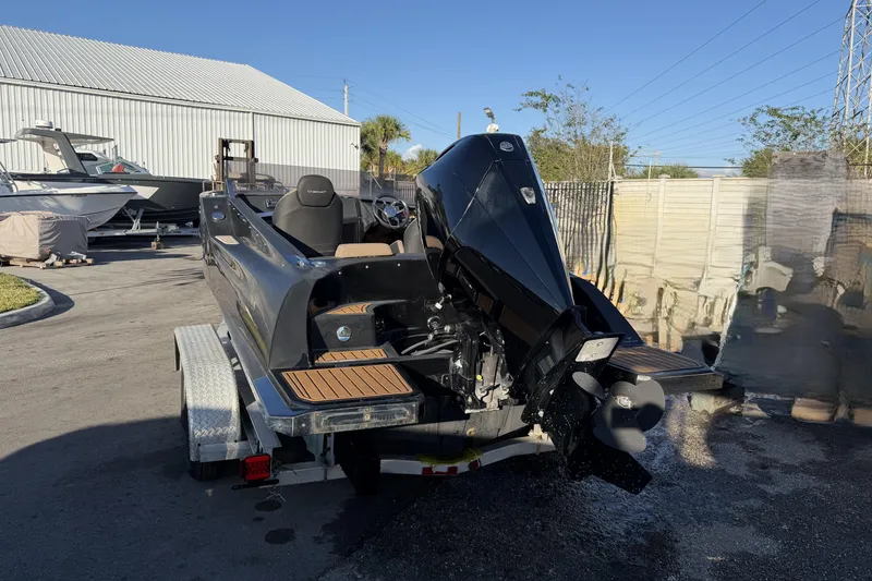 Slide: The Image of 2023 D-Boat Diamond 550 on trailer, rear view with outboard motor, sunny day. - 5