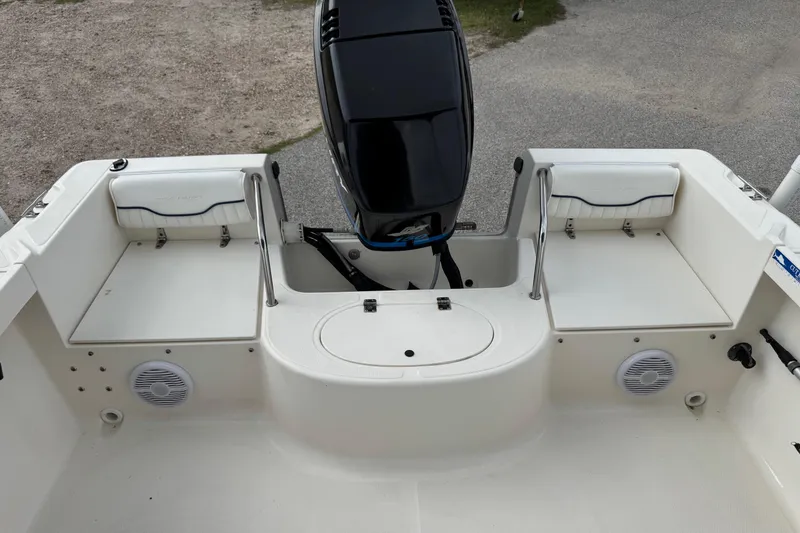 Slide: The Image of 2000 Sea Hunt Escape 200 boat interior with motor and seating area. - 17