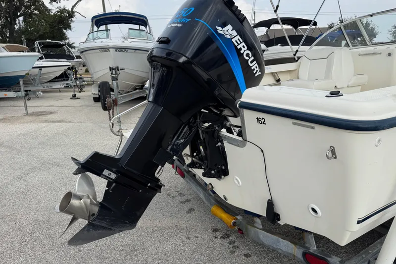 Slide: The Image of 2000 Sea Hunt Escape 200 boat with Mercury outboard motor on trailer. - 3