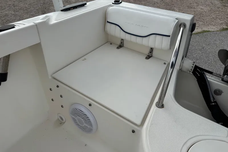 Slide: The Image of 2000 Sea Hunt Escape 200 boat interior with seating and speaker. - 8