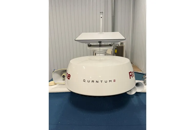 Slide: The Image of Engine compartment of a 2004 Formula 34 Performance Cruiser with visible wiring and components. - 12