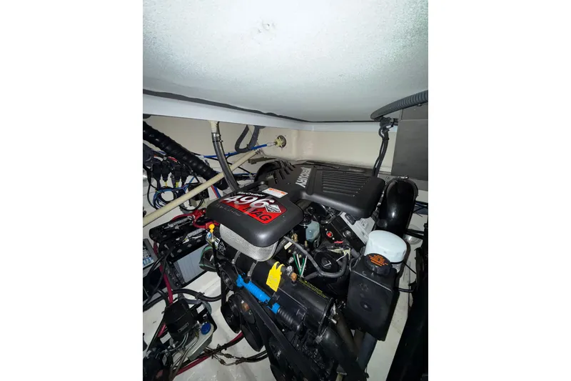 Slide: The Image of Engine compartment of a 2004 Formula 34 Performance Cruiser, showing belts and mechanical components. - 22