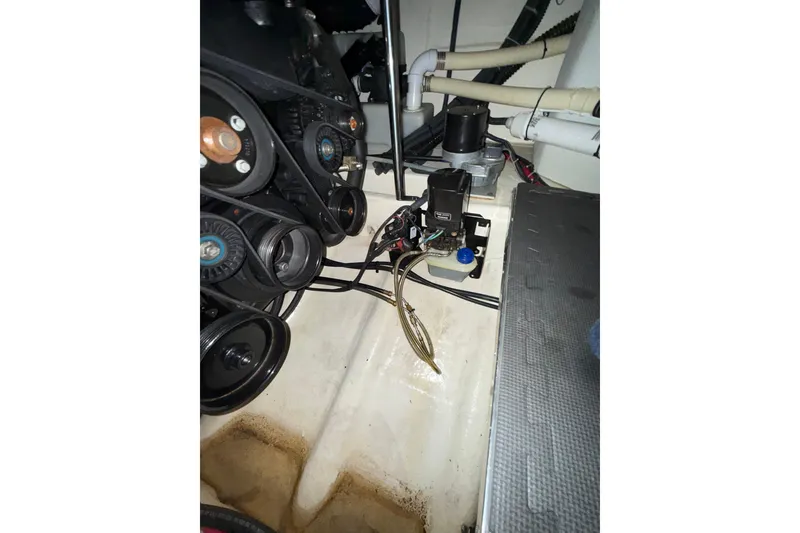 Slide: The Image of 2004 Formula 34 Performance Cruiser dashboard with navigation screens and gauges. - 25