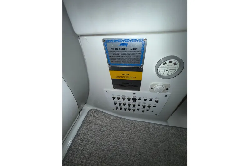 Slide: The Image of Control panel of a 2004 Formula 34 Performance Cruiser with joystick and cup holder. - 29