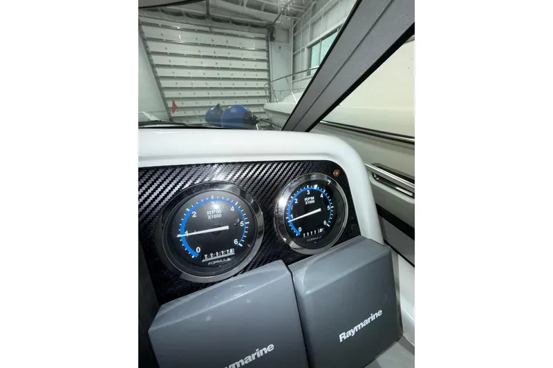 Slide: The Image of 2004 Formula 34 Performance Cruiser throttle controls and dashboard detail. - 30