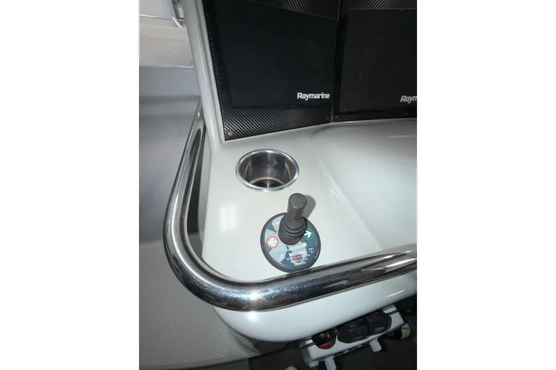 Slide: The Image of 2004 Formula 34 Performance Cruiser kitchen with sink, microwave, and storage cabinets. - 32